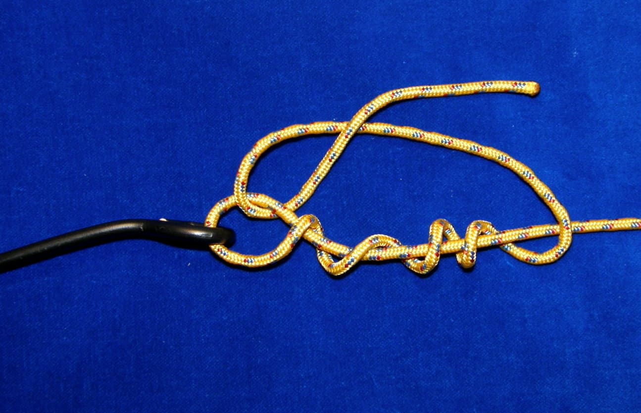 A clinch knot tied to a fishing hook eye, shown loosely for clarity